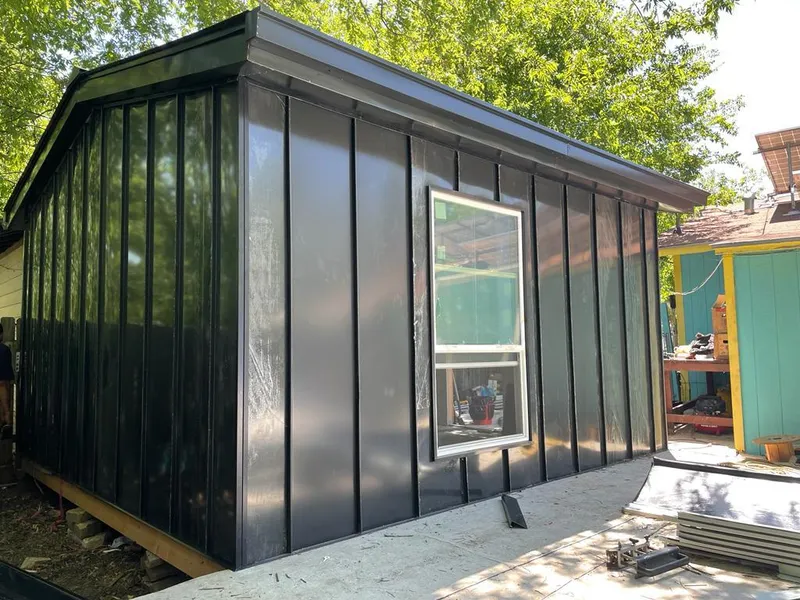 Black standing seam metal wall panels for Metal Roof Installation in Holmen