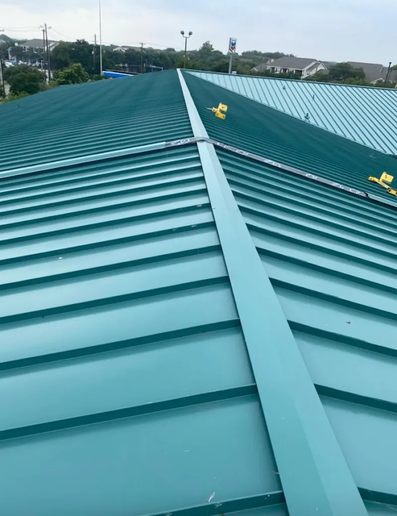 Green commercial metal roof ridge and valley for Metal Roof Repair in Holmen